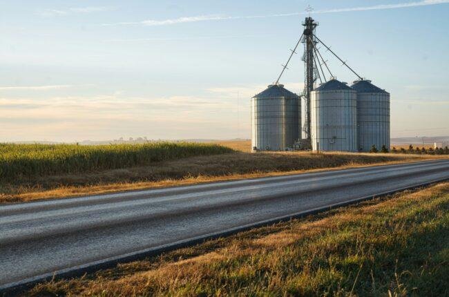 a couple of silos sitting on the side of a road in Lincoln Nebraska