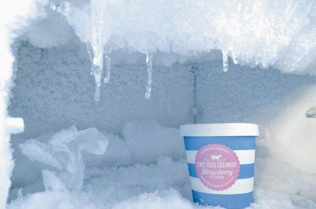 strawberry ice cream bottle inside container covered in ice