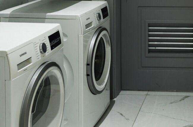 a washer and dryer sitting next to each other